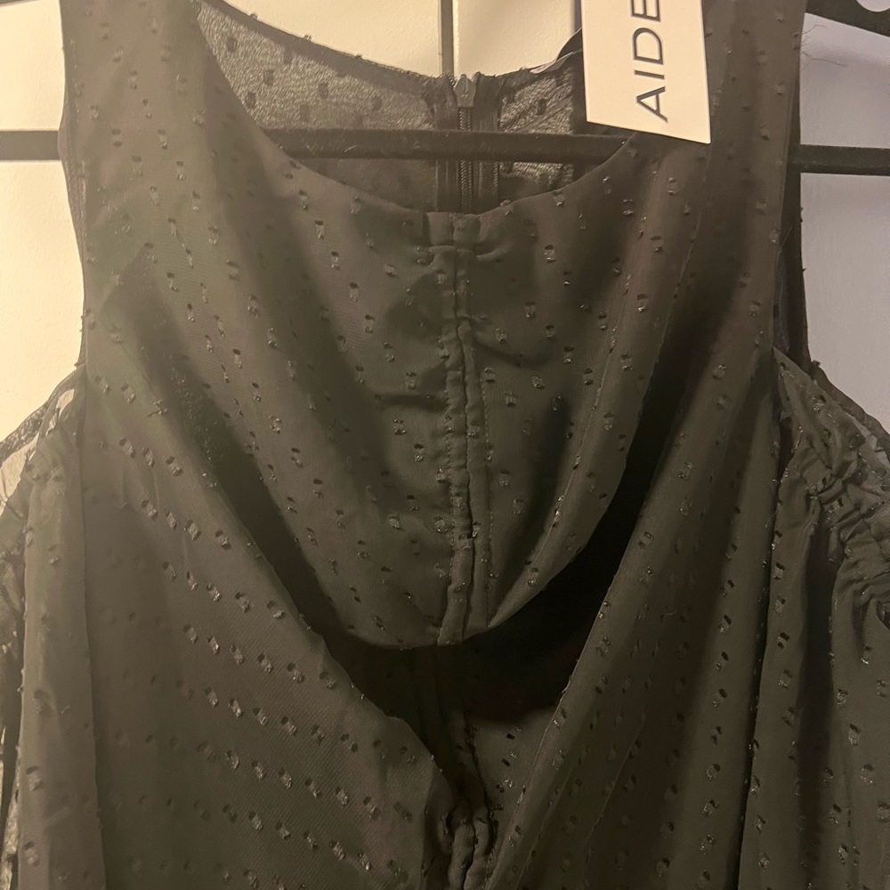Aiden black romper. Size medium. New with tags